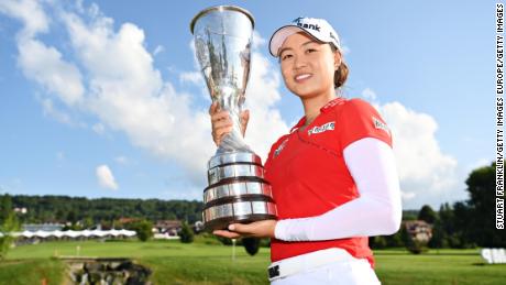 EVIAN-LES-BAINS, FRANCE - JULY 25: Tournament winner Minjee Lee of Australia poses for a photo with her trophy during day four of the The Amundi Evian Championship at Evian Resort Golf Club on July 25, 2021 in Evian-les-Bains, France. (Photo by Stuart Franklin/Getty Images)