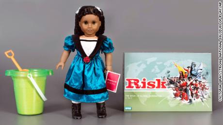 The three toys being inducted this year into the National Toy Hall of Fame are, from left: sand, The American Girl Doll, and the board game Risk.