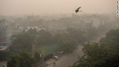 Morning haze envelops the skyline in New Delhi, India, on Friday, November 5.