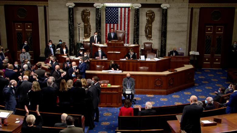 Cheers on House floor after Biden's infrastructure bill passes