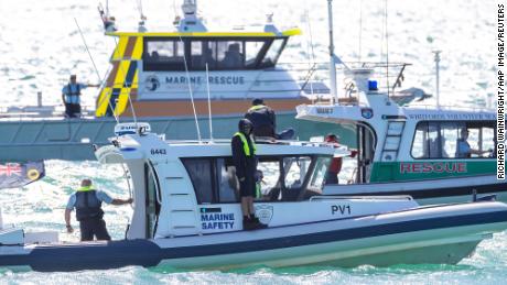Search and Rescue vessels are seen patroling off Port Beach in North Fremantle, Western Australia