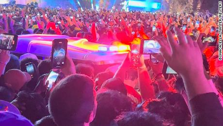 An ambulance is seen in the crowd during the Astroworld music festiwal in Houston, Texas, U.S., November 5, 2021 in this still image obtained from a social media video on November 6, 2021. Courtesy of Twitter @ONACASELLA /via REUTERS THIS IMAGE HAS BEEN SUPPLIED BY A THIRD PARTY. MANDATORY CREDIT.