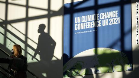 Delegates arrive at COP26 on Thursday. The day&#39;s theme was &quot;Energy,&quot; and more than 20 countries agreed to end financing of fossil fuel projects abroad.