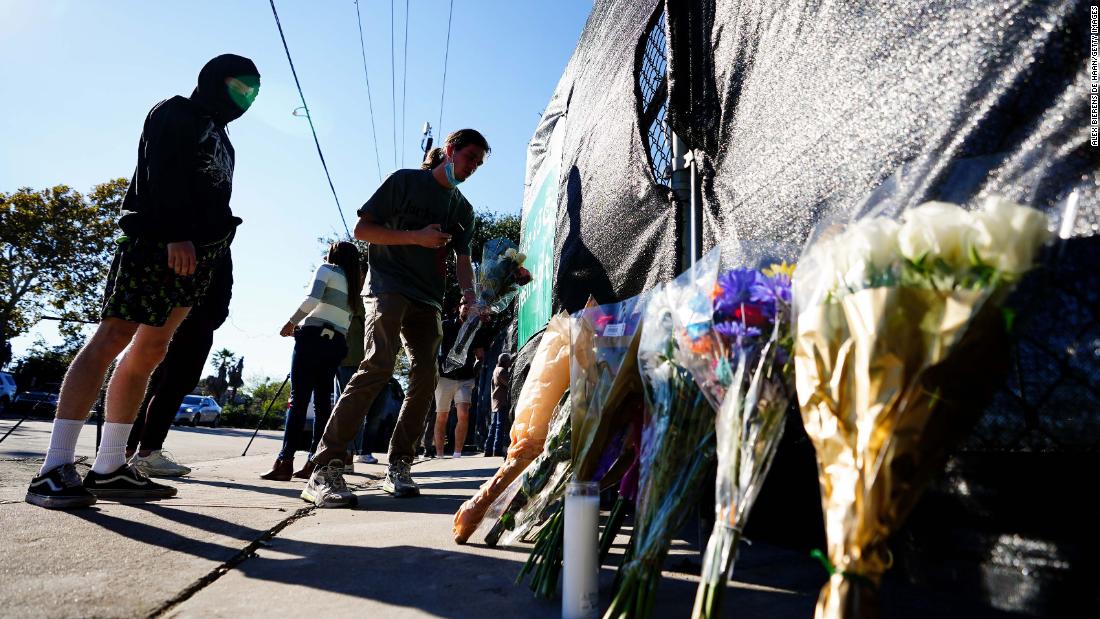 People mourned victims of the crowd surge by leaving flowers outside of NRG Park.