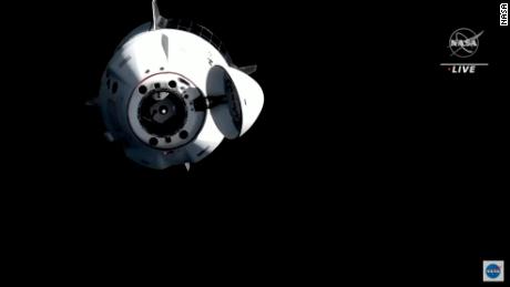 SpaceX&#39;s Crew Dragon capsule — carrying astronauts Shane Kimbrough, Megan McArthur, Thomas Pesquet, and Akihiko Hoshide — as seen as it detaches from the International Space Station and begins its journey home.