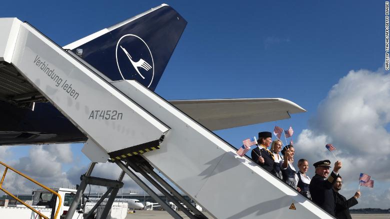 Lufthansa crew members before a flight from Munich, Germany to Miami, as European travelers celebrate the reopening of US borders.