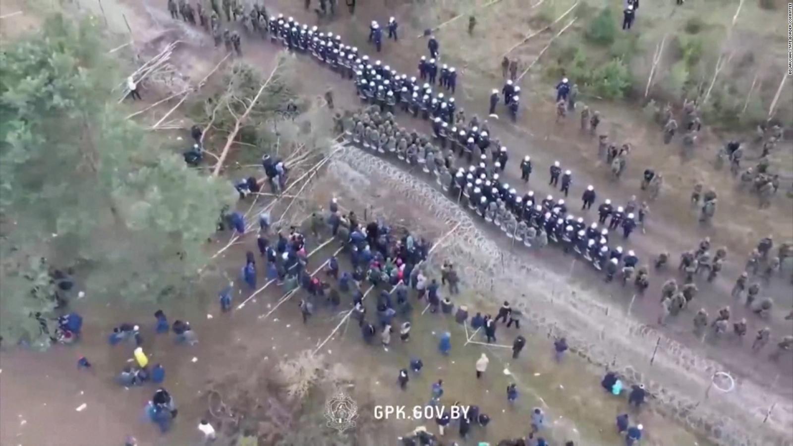 Tension at Poland-Belarus border grows as thousands of migrants caught in standoff - CNN Video