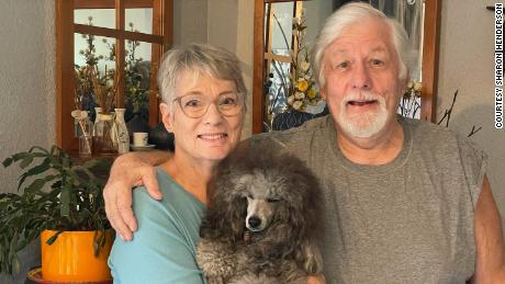 Sharon Henderson, shown with her husband, Paul, and dog, Dax, has started making her own burritos and casseroles to save money.