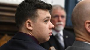 Dr. John Black testifies as Kyle Rittenhouse watches during his trial at the Kenosha County Courthouse in Kenosha, Wis., on Thursday, Nov. 11, 2021. Rittenhouse is accused of killing two people and wounding a third during a protest over police brutality in Kenosha, last year.  (Mark Hertzberg/Pool/AP)