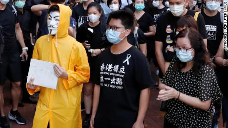 Hong Kong activist dubbed &quot;Captain America 2.0&quot; Ma Chun-man (center) attends a vigil on June 15, 2020 for a protester who fell to his death during a demonstration.