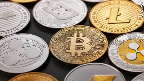 Coins representing crypto currency of bitcoin, ethereum, litecoin, monero, ripple, dash, on a dark background, a pattern of coins. Business, finance and technology concept.