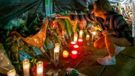 Hannah Longoria attends a makeshift memorial for those who died at the Astroworld Festival in Houston