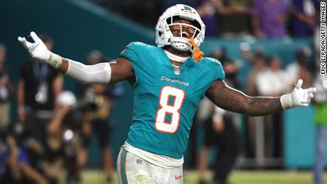 Jevon Holland of the Miami Dolphins celebrates after a game-ending interception against the Baltimore Ravens. 
