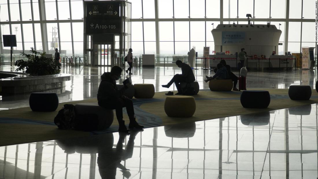 Passengers wait for a flight at Daxing Airport in Beijing on February 8, 2021.