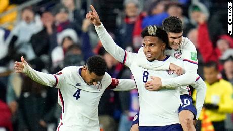 Weston McKennie celebrates his goal with Tyler Adams and Christian Pulisic against Mexico.