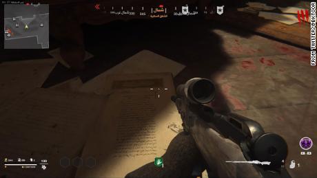 Pages from Islam&#39;s holy book are seen on the ground in a scene from Call of Duty: Vanguard.