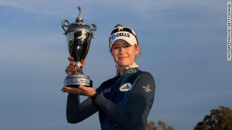 Nelly Korda poses with the trophy after winning the Pelican Women&#39;s Championship.
