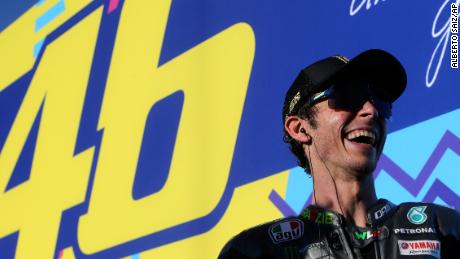 MotoGP rider Valentino Rossi of Italy smiles after the Valencia Motorcycle Grand Prix, the last race of the season, at the Ricardo Tormo circuit in Cheste, near Valencia, Spain, Sunday, Nov. 14, 2021. Rossi will be retiring from MotoGP racing as the season ends in Valencia. (AP Photo/Alberto Saiz)