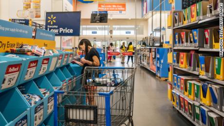 HOUSTON, TEXAS - AUGUST 04: A customer shops at a Walmart store on August 04, 2021 in Houston, Texas. The cost of back-to-school items is on the rise due to a combination of delays in U.S. manufacturing and heightened consumer demand for goods. The steep increases are partially due to both elementary and college-aged students returning back to school after missing in-person class sessions during the pandemic.  (Photo by Brandon Bell/Getty Images)
