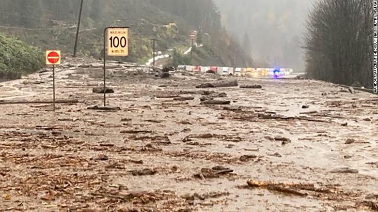 Rescuers work to reach up to 275 people trapped on a British Columbia highway after hammering rain