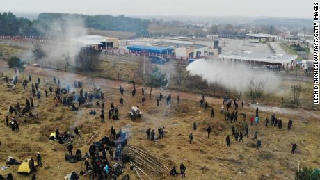 Smoke risis over the border, where thousands of migrants have gathered.