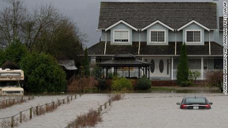 A vehicle submerged in flood waters in Abbotsford, British Columbia, on Monday.
