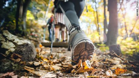 Hiking outdoors, surrounded by nature, boosts your outlook, according to studies.