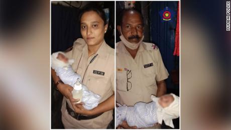 Mumbai Police hold a baby who was found in a drain in this image the police posted on twitter.