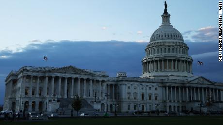 WASHINGTON, DC - NOVEMBER 18: The sun sets behind the U.S. Capitol on November 18, 2021 in Washington, DC. Following the final Congressional Budget Office cost estimate, House Democrats are hoping to vote on President Joe Biden&#39;s $1.75 trillion social benefits and climate legislation Thursday.  (Photo by Chip Somodevilla/Getty Images)