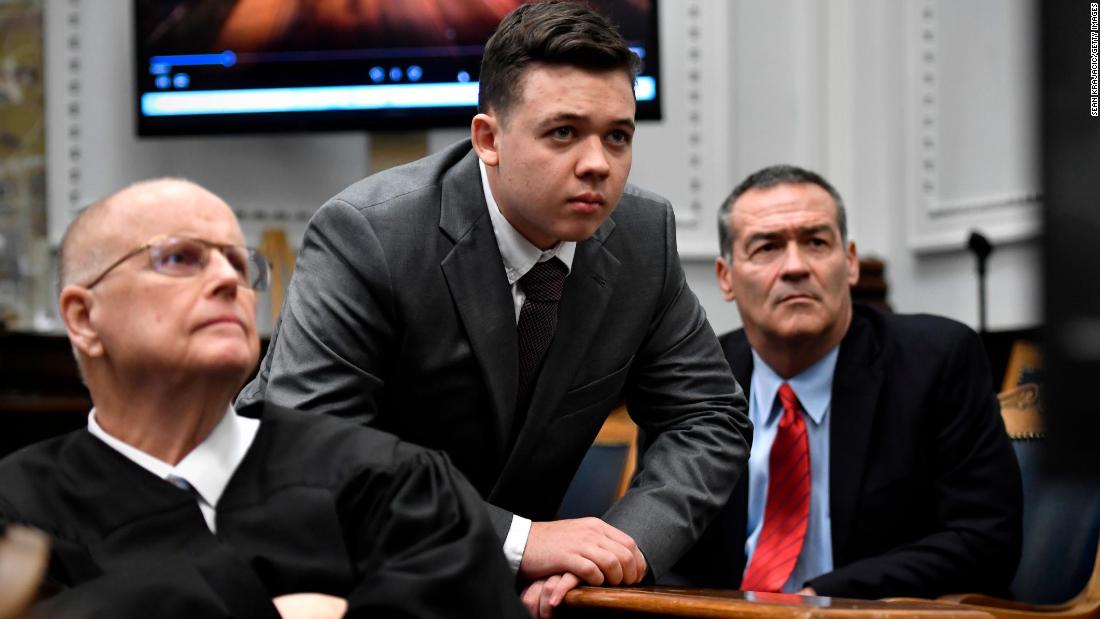 Judge Bruce Schroeder, left, Kyle Rittenhouse, center, and his attorney Mark Richards watch an evidence video during Rittenhouse';s trial  on November 12, 2021 in Kenosha, Wisconsin.  