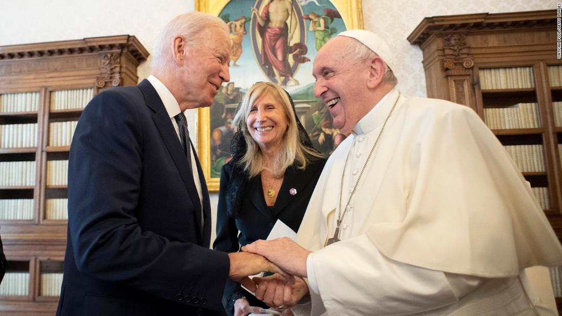 Biden gives Pope Francis a challenge coin during &lt;a href=&quot;https://www.cnn.com/2021/10/29/politics/pope-francis-joe-biden-meeting/index.html&quot; target=&quot;_blank&quot;&gt;his trip to the Vatican&lt;/a&gt; in October 2021. Between them is Italian translator Elisabetta Savigni Ullmann. It was the fourth meeting between Francis and Biden, but their first since Biden became President. Biden, a devout lifelong Catholic, met with the Pope for 90 minutes and said he discussed &quot;a lot of personal things&quot; with the pontiff.