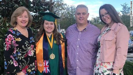 Erin Crosbie stands with her parents and sister after her graduation with a bachelor&#39;s in nursing from the University of South Florida. &quot;I got what I though was the right degree, the right career path. ... I totally did not know that my whole life was about to get turned upside down,&quot; she says.