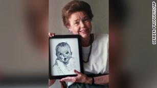 Ann Turner Cook holds a picture of the Gerber Baby sketch in a 1998 photo.