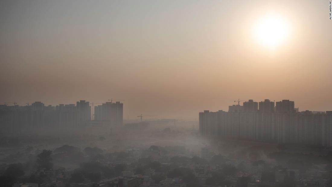 Morning haze envelops the skyline on the outskirts of New Delhi, India in October 2020.