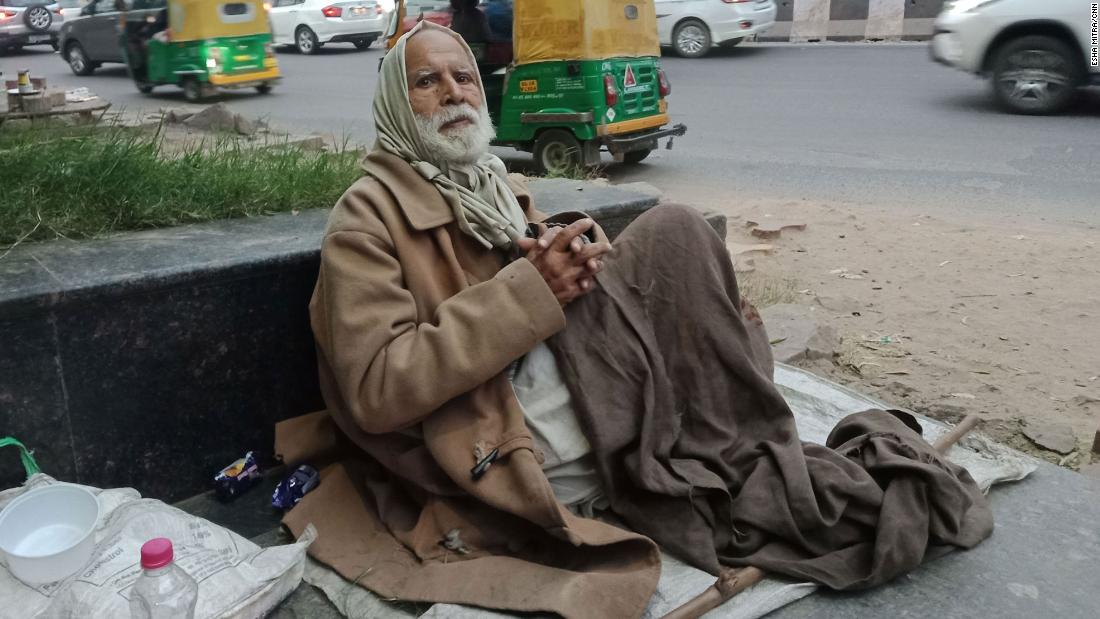 Gulpreet Singh begs for food outside Delhi's South Campus station. He struggles to breathe in the pollution. 