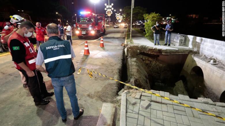 Sidewalk collapses during Brazil parade, sending 30 people into river