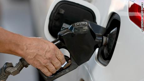 A customer pumps gas into his vehicle at a Shell station on November 22, 2021 in Miami, Florida. 