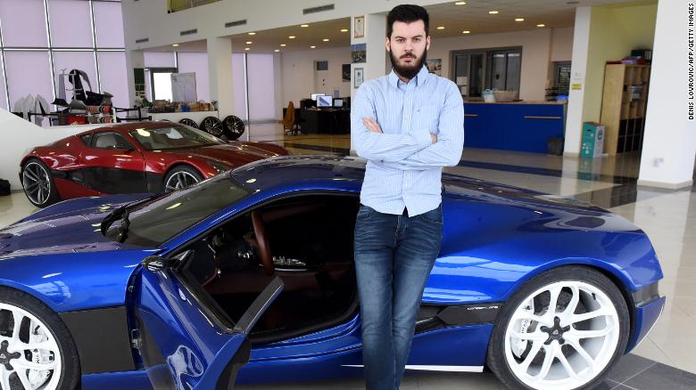 Mate Rimac poses next to his &quot;Concept One&quot; supercar model at his factory and showroom in Sveta Nedelja, Croatia, on February 17, 2016.