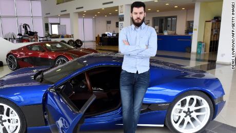 Mate Rimac poses next to his &quot;Concept One&quot; supercar model at his factory and showroom in Sveta Nedelja, Croatia, on February 17, 2016.