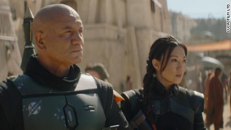 (From left) Temuera Morrison as Boba Fett and Ming-Na Wen as Fennec Shand star in &quot;The Book of Boba Fett.&quot;