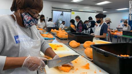 Curlie Jackson cuts yams for the Thanksgiving Super Feast.