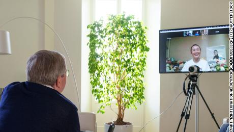 A handout photo made available by the IOC shows the organization's president Thomas Bach holding a video call with Peng Shuai on 21 November.