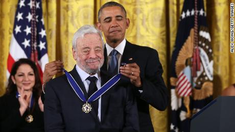 US President Barack Obama (R) presents the Presidential Medal of Freedom to theatrical composers and lyricists Stephen Sondheim (L) during an East Room ceremony November 24, 2015 at the White House in Washington, DC. 