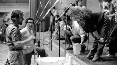 Actress-singer Bernadette Peters, star of Broadway&#39;s &quot;Sunday in the Park with George,&quot; leans forward to discuss the recording of the show&#39;s album with composer-lyricist Stephen Sondheim, left, and producer of the album Thomas Z. Shepard at the RCA Recording Studio in New York City, June 1984.  (AP Photo/Marty Reichenthal)