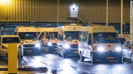 Red Cross medical staff transport passengers infected with coronavirus returning to the Netherlands from South Africa, to the quarantine area of ​​a hotel.