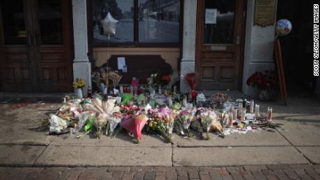 An investigation into the 2019 Dayton, Ohio, mass shooting found the gunman acted alone and was not aligned with a specific ideological group. A memorial to those killed formed along the sidewalk on August 6, 2019.