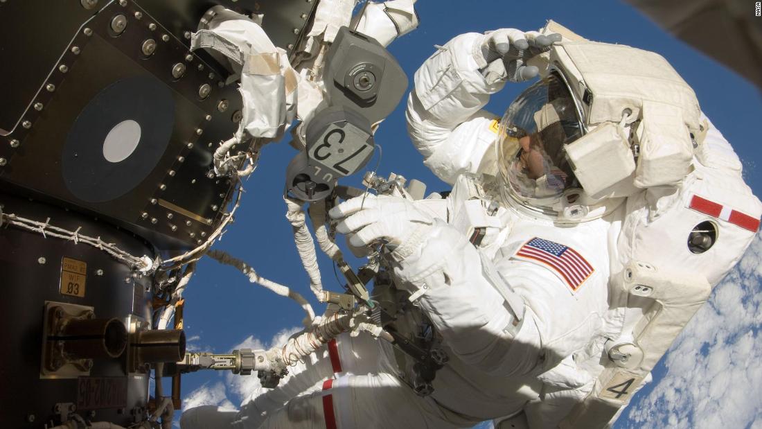 NASA astronauts conduct spacewalk postponed due to debris risk - CNN