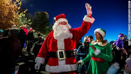 Santa Claus arrives at a holiday event at HarborWalk in Boston on November 21, 2021.  Some companies are already booking Santas for next year&#39;s holiday season. 