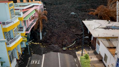 New lava flowing from Spain&#39;s Cumbre Vieja volcano destroys homes and infrastructure on the Canary Island of La Palma on Monday. 