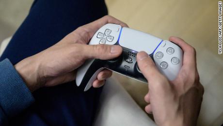 In a photo taken on November 12, 2020, a gamer plays on the new Sony Playstation PS5 at his home in Seoul after Sony launched the new console in select markets around the world. 